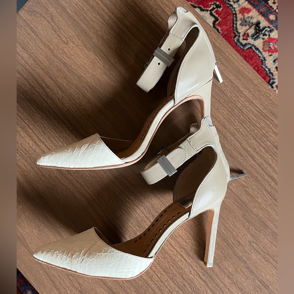 Never been worn. High heel w/strap